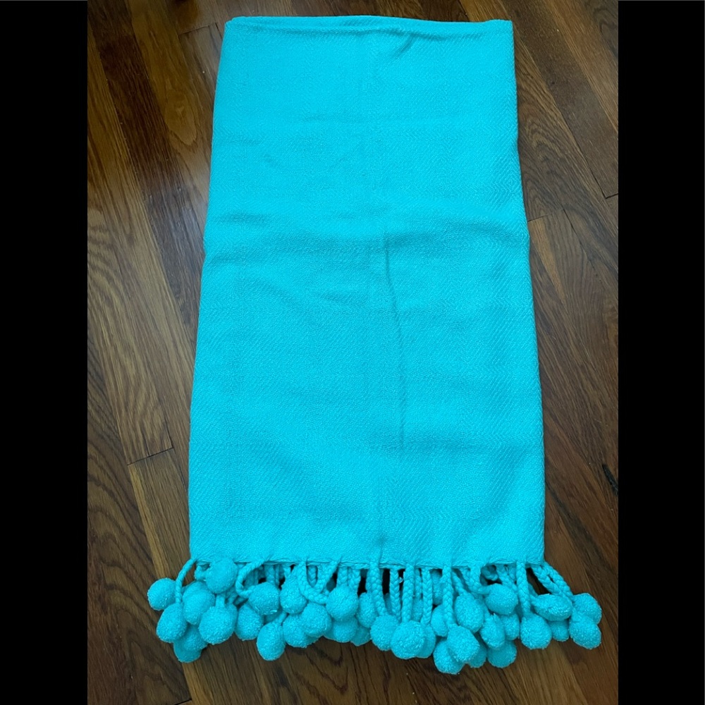KARMA LIVING COTTON THROW WITH ADORABLE POM POM TRIM. COLOR: TURQUOISE.